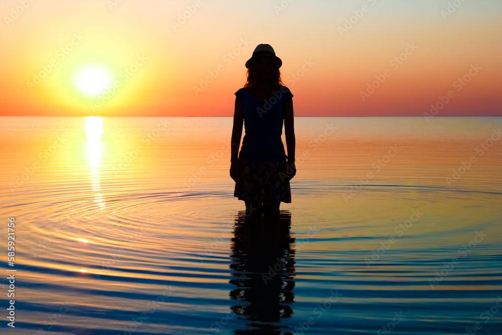 Fototapeta premium A Happy girl by the sea on nature silhouette travel