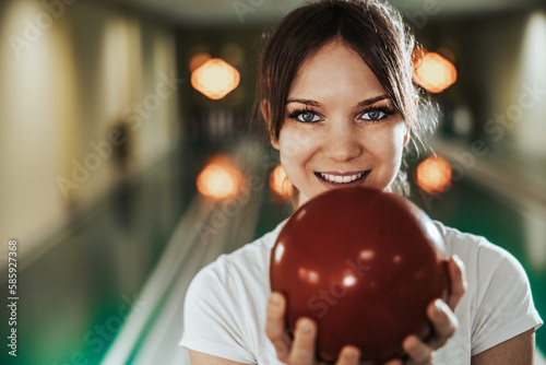 Fotografie Girl In A Bowling Alley