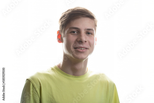 Portrait of a smiling teenager on a white background. Portrait of a young man.