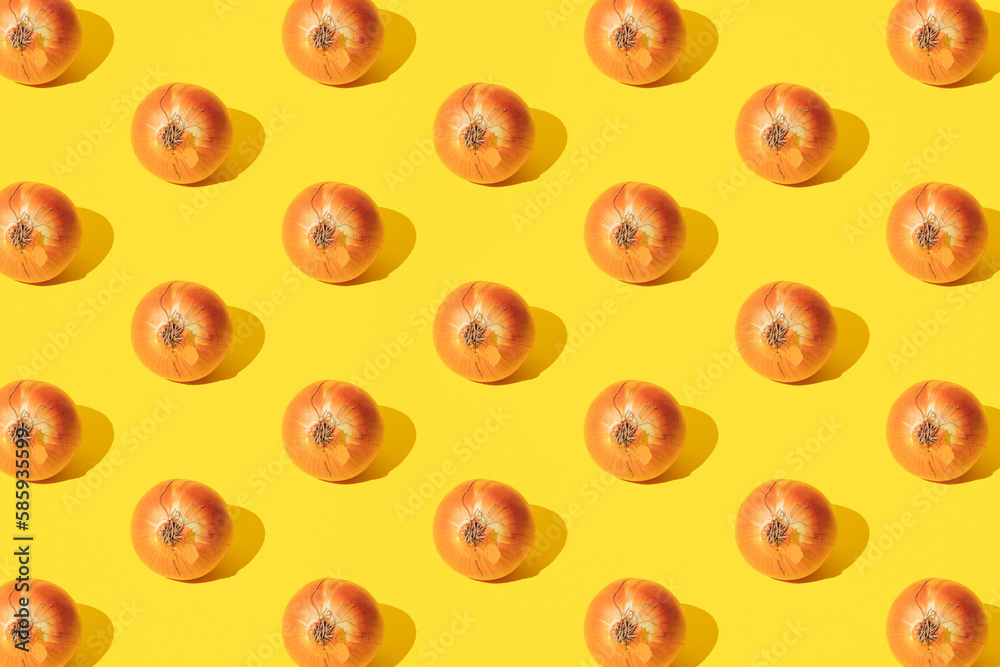 Onion on a yellow background. Minimal pattern. Onion on a yellow background. Minimal pattern.