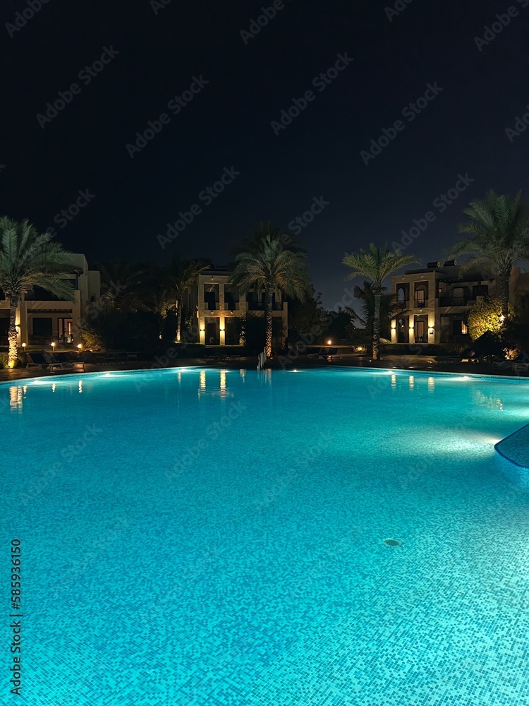 view of the night pool and water surface