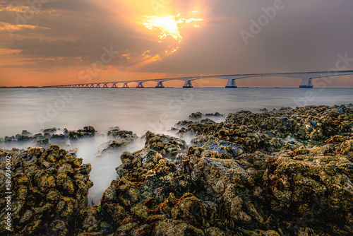 Fototapeta Naklejka Na Ścianę i Meble -  The Zeelandbrug photographed at sunrise with oyster sahore