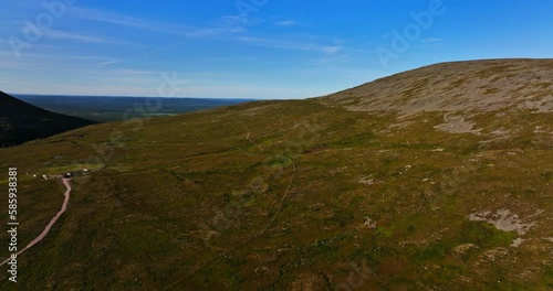 Aerial view rising over hiking trails on the Ounastunturit fells, summer evening in Lapland photo