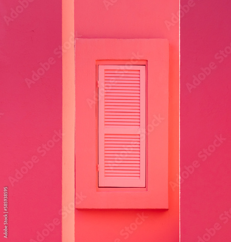 pink wall with a window blind