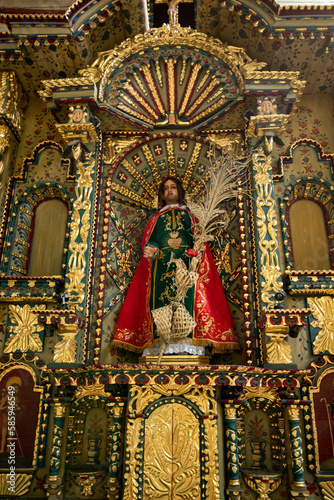 HUANCAVELICA, PERU - APRIL 16, 2022: San Juan Evangelista. Religious sculpture found in the church of Ascension - Huancavelica. © Wilder