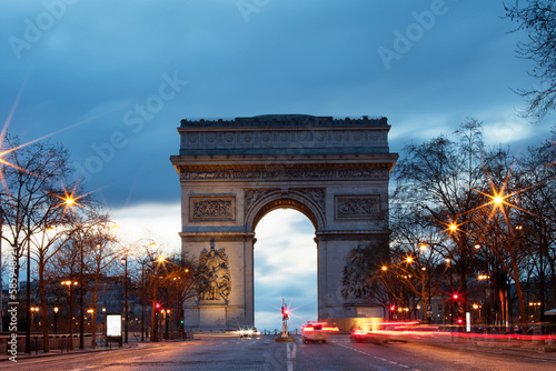 The Triumphal Arch in rainy evening, Paris, France. © kovalenkovpetr