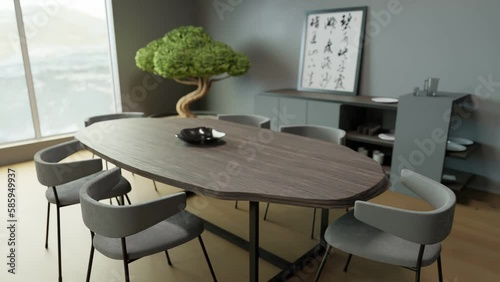 Rotating shot of a uniquely shaped dining table with a bonsai tree in the background photo