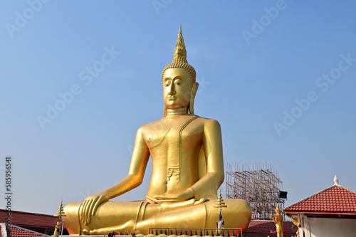BANGKOK  THAILAND   March 29  2023 - The Big Golden Buddha Statue with blue sky and white cloud in Buddhist temples in Bangkok  Thailand. Concept for those who have faith to come to pay respect.
