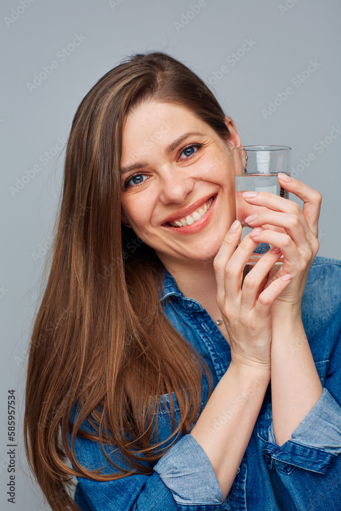 Close up face portrait of smiling woman holding water glass. Close up face portrait of smiling woman holding water glass.