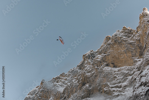 paraglider over the mountains in winter