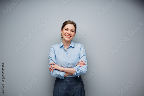 Smiling business woman with crossed arms isolated portrait.