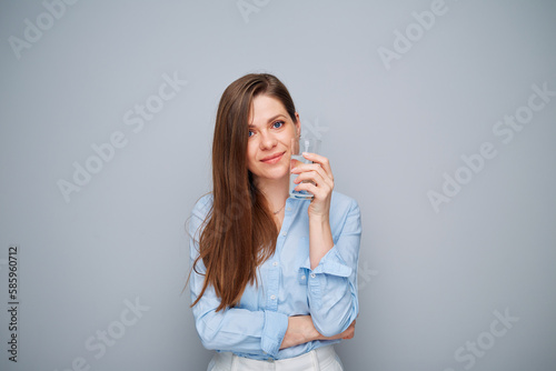 Beautiful young woman holding water glass.