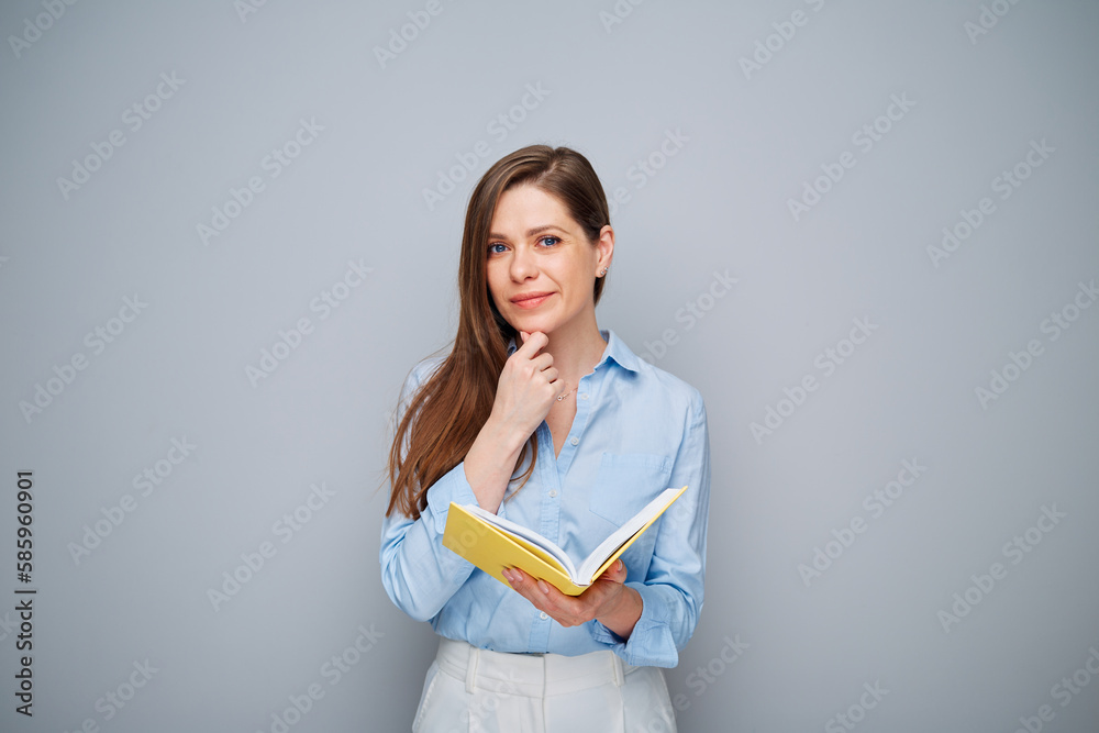 Smiling teacher or student woman with book. Isolated female portrait.
