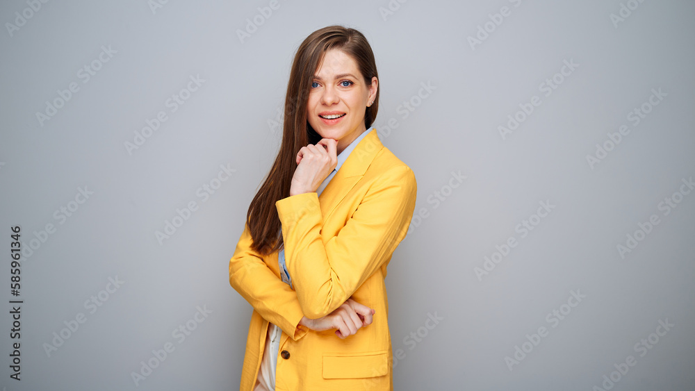 Thinking smart business woman in yellow jacket on gray background. Thinking smart business woman in yellow jacket on gray background.