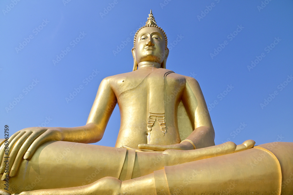 BANGKOK, THAILAND : March 29, 2023 - The Big Golden Buddha Statue with blue sky and white cloud in Buddhist temples in Bangkok, Thailand. Concept for those who have faith to come to pay respect. BANGKOK, THAILAND : March 29, 2023 - The Big Golden Buddha Statue with blue sky and white cloud in Buddhist temples in Bangkok, Thailand. Concept for those who have faith to come to pay respect.