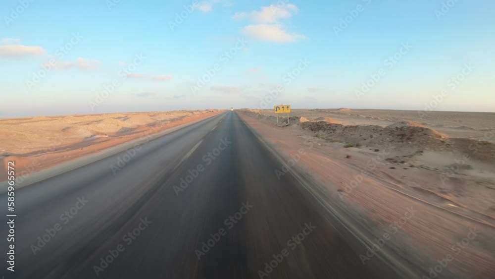 Driving in Sahara, the road in the desert, near Hurghada, Egypt Driving in Sahara, the road in the desert, near Hurghada, Egypt