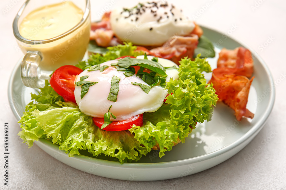 Plate with tasty egg Benedict on white table, closeup Plate with tasty egg Benedict on white table, closeup