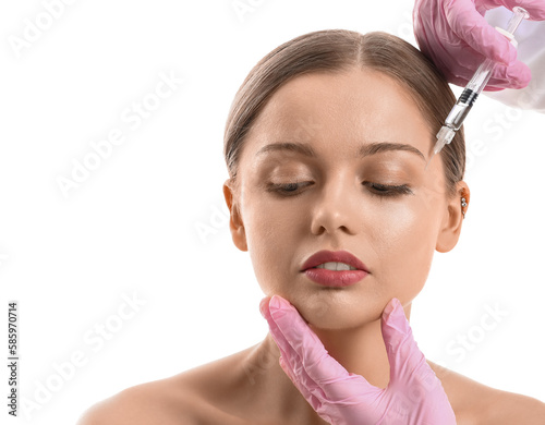 Young woman receiving facia...