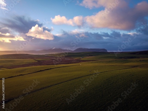 Green fields by sunny day near Stromness, Orkney Islands, Scotland