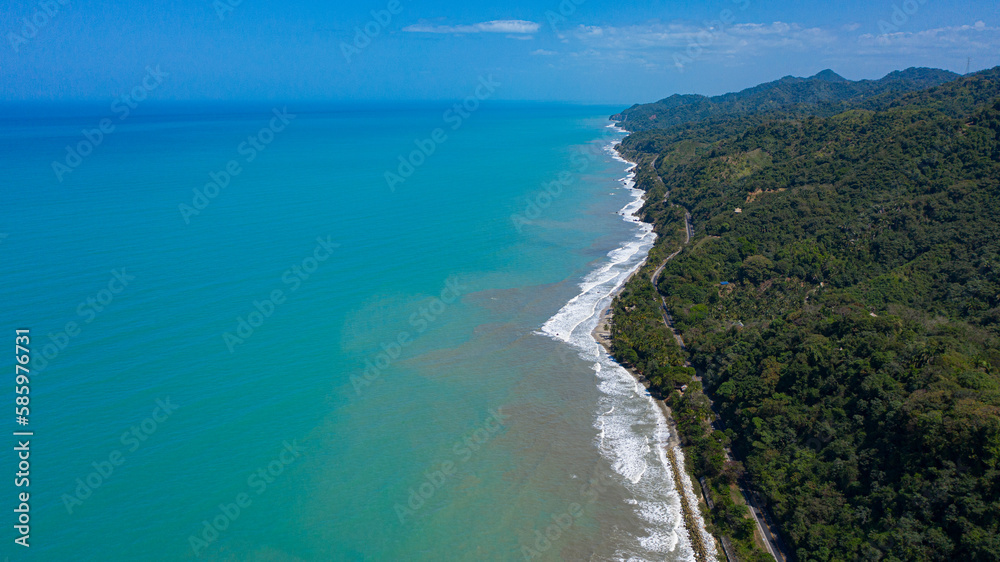 aerial view of a road on the shore of the blue sea aerial view of a road on the shore of the blue sea
