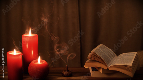 real incense smoke and candle flame burning on the wooden table, books and red candles with flame, cozy home background, relaxation and meditation concept 4k wallpaper