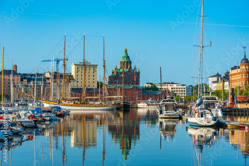 Uspenski Cathedral rising above kruununhaka marina in Helsinki, Finland photo