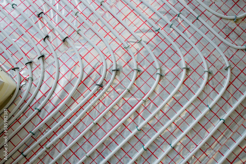Close-up of Installed Pipes for Warm Floor ready for connection to a heat pump or boiler. Efficient Underfloor Heating System