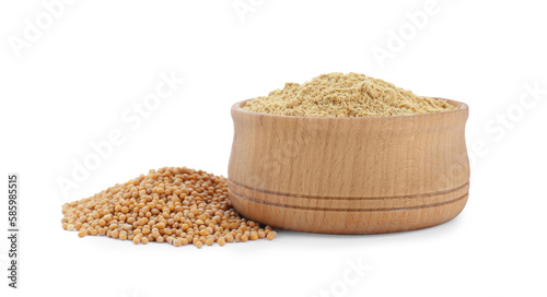 Aromatic mustard powder in wooden bowl and seeds on white background