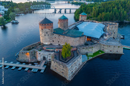 Sunset view of Olavinlinna castle in Savonlinna, Finland photo