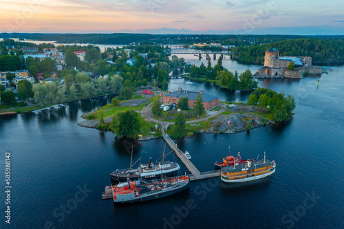 Sunset view of Olavinlinna castle and Riihisaari Museum in Savonlinna, Finland photo