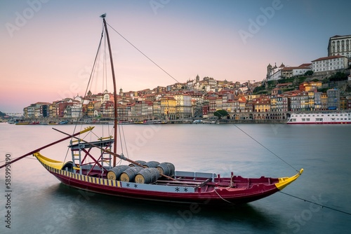 Low-angle of Porto cityscape at sunset, purple sky background