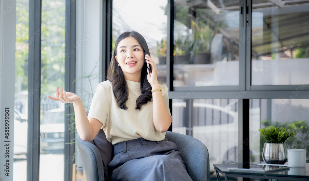 Business woman bookkeeper's hand use smartphones doing account for paying taxes in the working office Business woman bookkeeper's hand use smartphones doing account for paying taxes in the working office