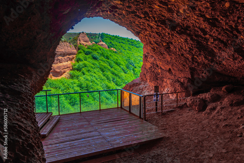 Open end of an ancient tunnel at Las Medulas - ancient gold mining site near Ponferrada in Spain photo
