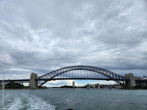Sydney harbour bridge covered in clouds © Fadhila