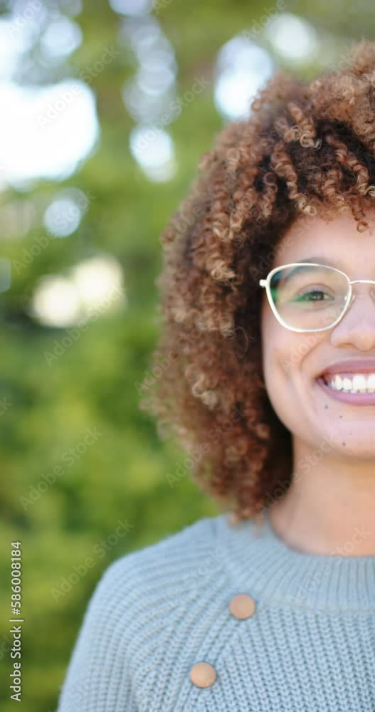Vertical video of portrait of happy biracial woman in garden in slow motion Vertical video of portrait of happy biracial woman in garden in slow motion