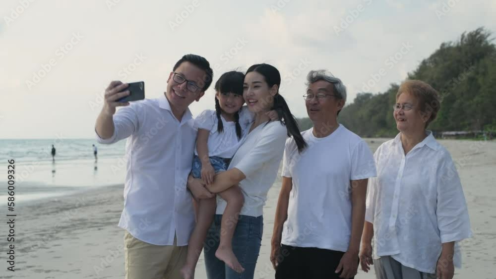 Holiday concept of 4k Resolution. Every family member is taking a photo together at the sea. Holiday concept of 4k Resolution. Every family member is taking a photo together at the sea.