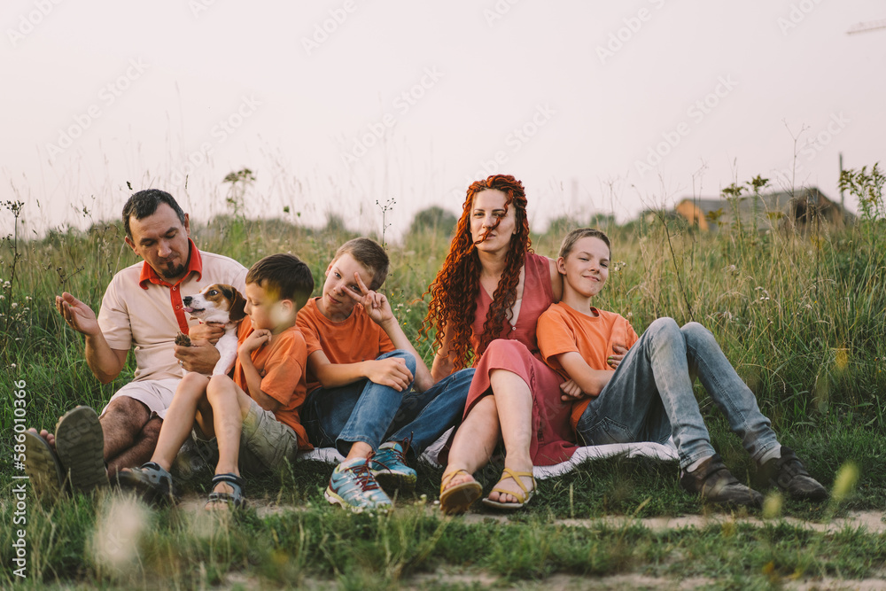 Portrait of a family in nature. Children and parents play in nature. Good time with family on vacation. Happy family day Portrait of a family in nature. Children and parents play in nature. Good time with family on vacation. Happy family day