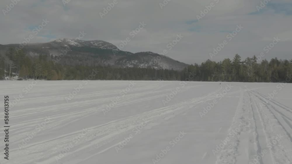 POV driving across Lake Moosehead for ice fishing