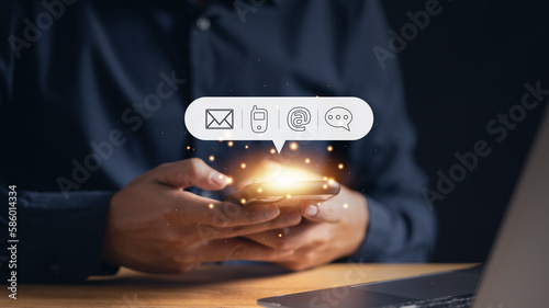 Cuadro en lienzo Man using his phone with an email icon, highlighting the importance of digital communication and online connectivity in modern business operations
