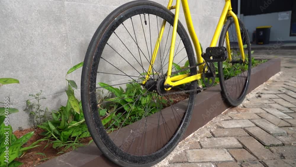 City bicycle fixed gear on grey wall. Cycling or commuting in city urban environment, ecological transportation concept. City bicycle fixed gear on grey wall. Cycling or commuting in city urban environment, ecological transportation concept.