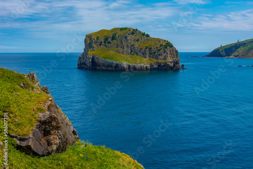 Akatxa irla island near San Juan de Gaztelugatxe church, Spain photo