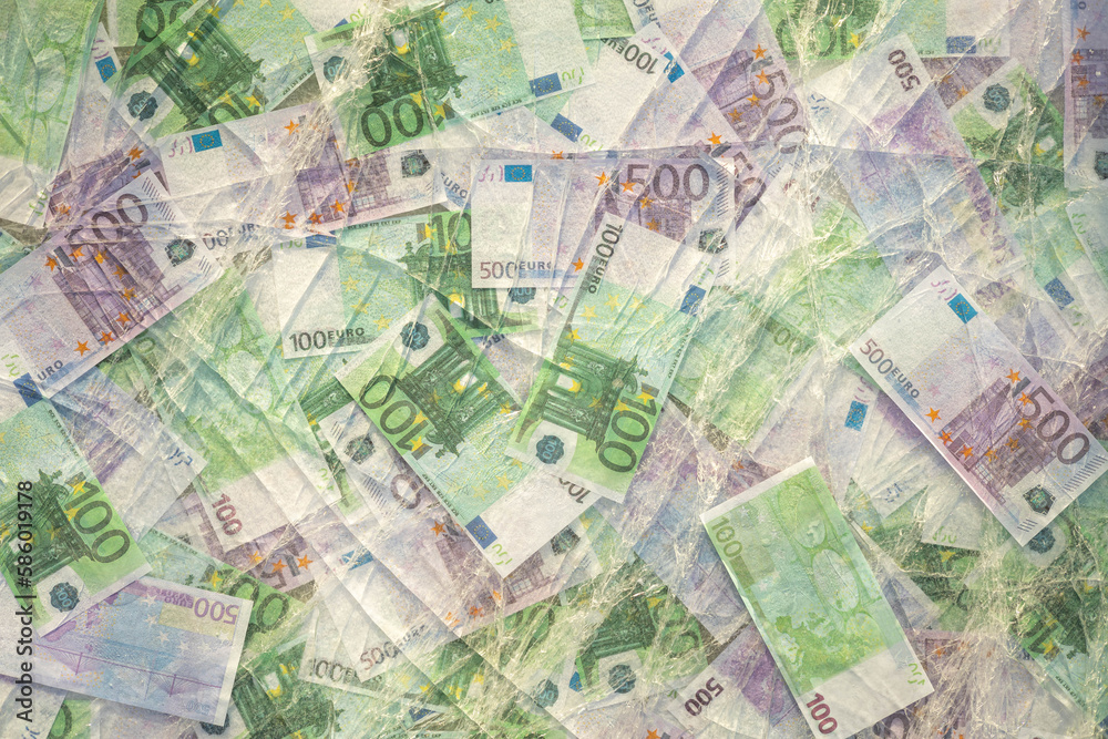 Blurred photo of one hundred and five hundred euros are defrosted in ice. The European cash currency is frozen.