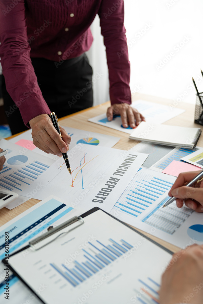 A group of Asian businessmen are brainstorming to analyze financial reporting situations. Calculate your investments with this calculator, income, tax and accounting from data graphs at your desk. A group of Asian businessmen are brainstorming to analyze financial reporting situations. Calculate your investments with this calculator, income, tax and accounting from data graphs at your desk.