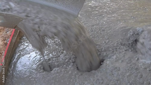 Close up of pouring a building surface with cement.