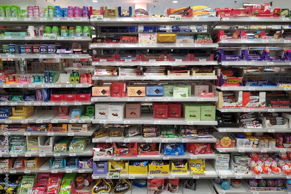 PENANG, MALAYSIA 26 MAR 2023 Various choice of candies and chocolate selling in FamilyMart