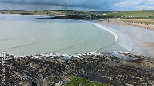 Beautiful and unusual colours of ocean with sand beach and long waves, view from above photo