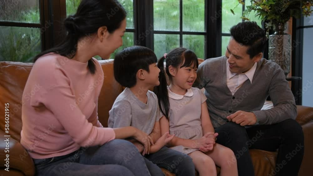 Family concept of 4k Resolution. Asian parents and children chatting together in the house. Family concept of 4k Resolution. Asian parents and children chatting together in the house.
