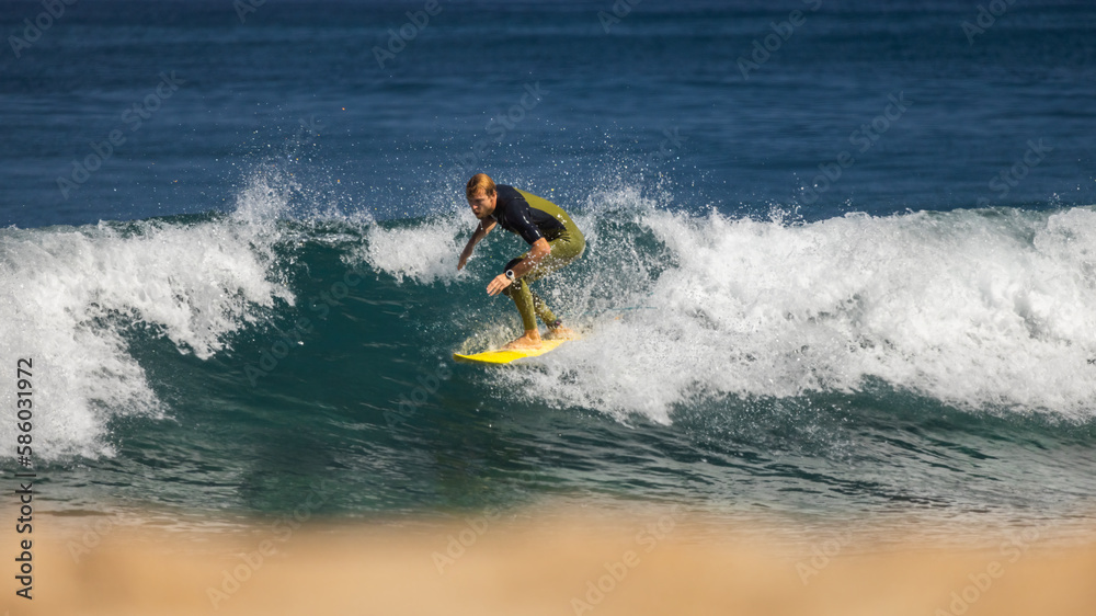 Professional surfer on an ocean wave.