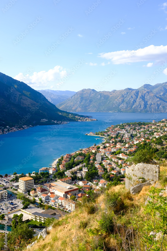 Kotor Montenegro. Boko Kotor Bay panoramic view. Beautiful summer day with blue sky and clouds.
