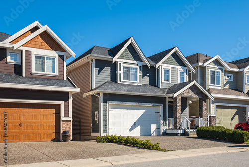 A perfect neighborhood. Houses in suburb at Spring in the north America. Real Estate Exterior Front House on a sunny day